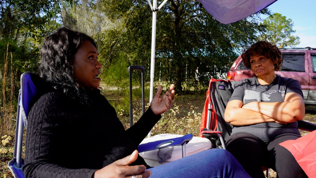 Sarah B. Hayes speaks with supporter Ellen Neal during the Nov. 5, 2023 mayoral runoff in Walthourville. Hayes unseated incumbent mayor Larry D. Baker.