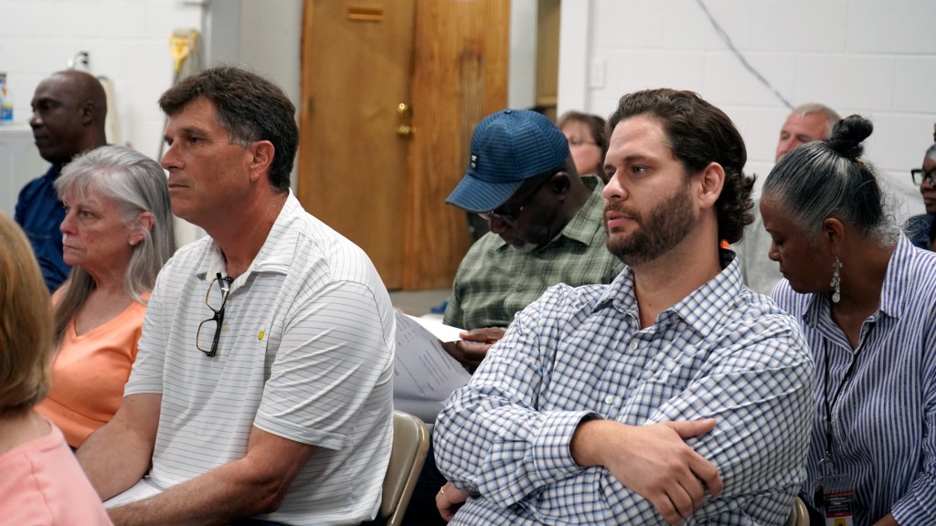 (L-R) Sam Sullivan of Atlantic Waste and Charles Stewart of ABC Waste listen during Walthourville's public hearing on privatizing sanitation, Aug. 22, 2024.